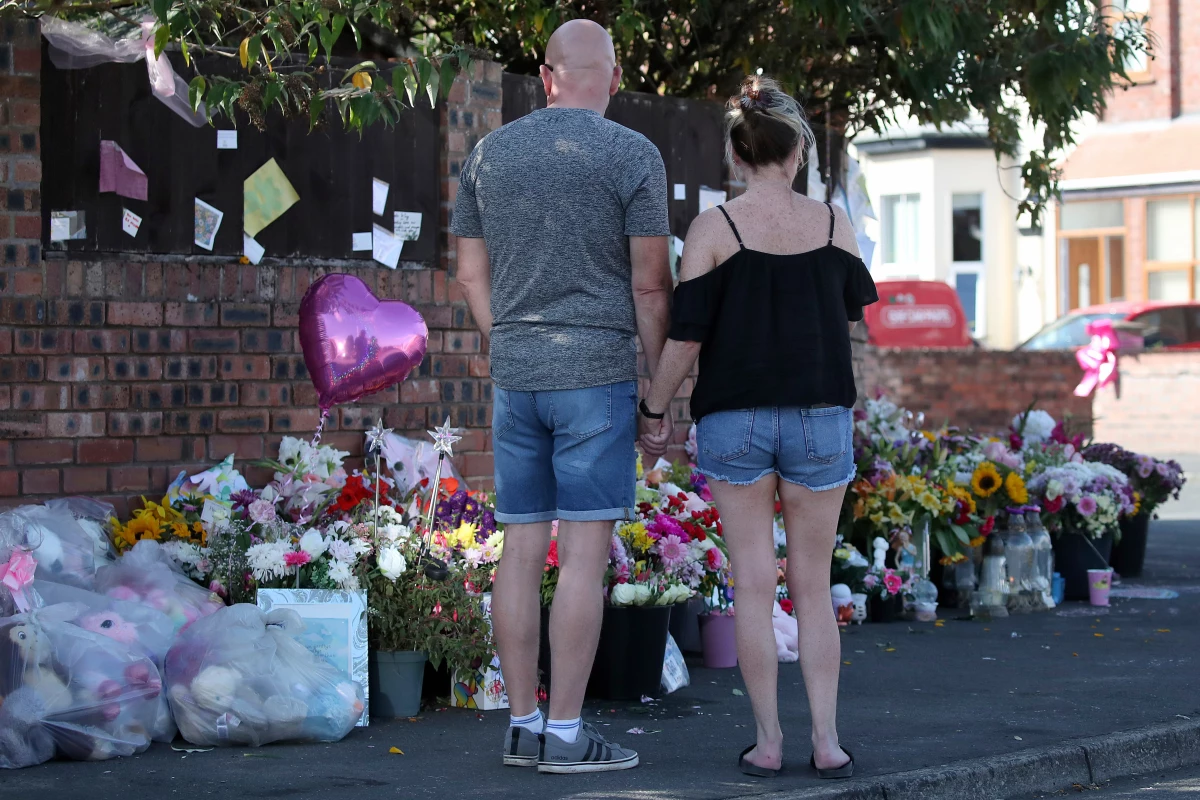 FILE - Floral tributes are left at the site in Southport, England, Aug. 11, 2024 after three young girls were killed in a knife attack at a Taylor Swift-themed holiday club.