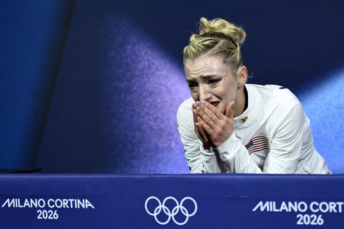Amber Glenn reacts to her score in the women's short program event on Tuesday. She got docked for landing a double loop instead of a triple loop, despite an otherwise strong performance.