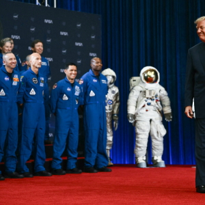 Astronauts look on as President Trump arrives to speak during a Congressional Space Medal of Honor presentation at NASA Lyndon B. Johnson Space Center in Houston, Texas, on Aug. 28, 2026.