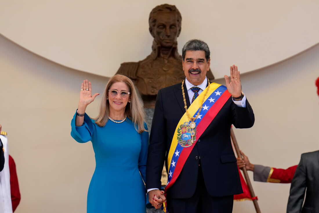 FILE - Venezuelan President Nicolas Maduro and his wife Cilia Flores wave after his swearing-in ceremony for a third term at the National Assembly in Caracas, Venezuela, on Jan. 10, 2025.