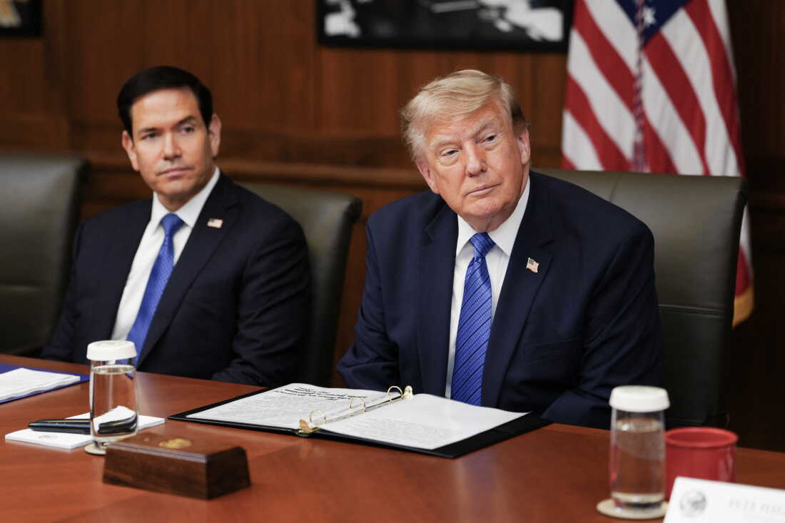 President Donald Trump, alongside US Secretary of State Marco Rubio (L), speaks during a Cabinet meeting at Camp David in Maryland, on July 31, 2026.