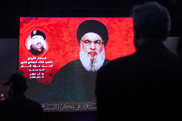Supporters listen to Hezbollah leader Hassan Nasrallah via a video link during a ceremony to mark the first week since the killing of Hezbollah's top commander Fuad Shukr on August 6 in Beirut. The militant group on Saturday confirmed Nasrallah had been killed following Israeli airstrikes.