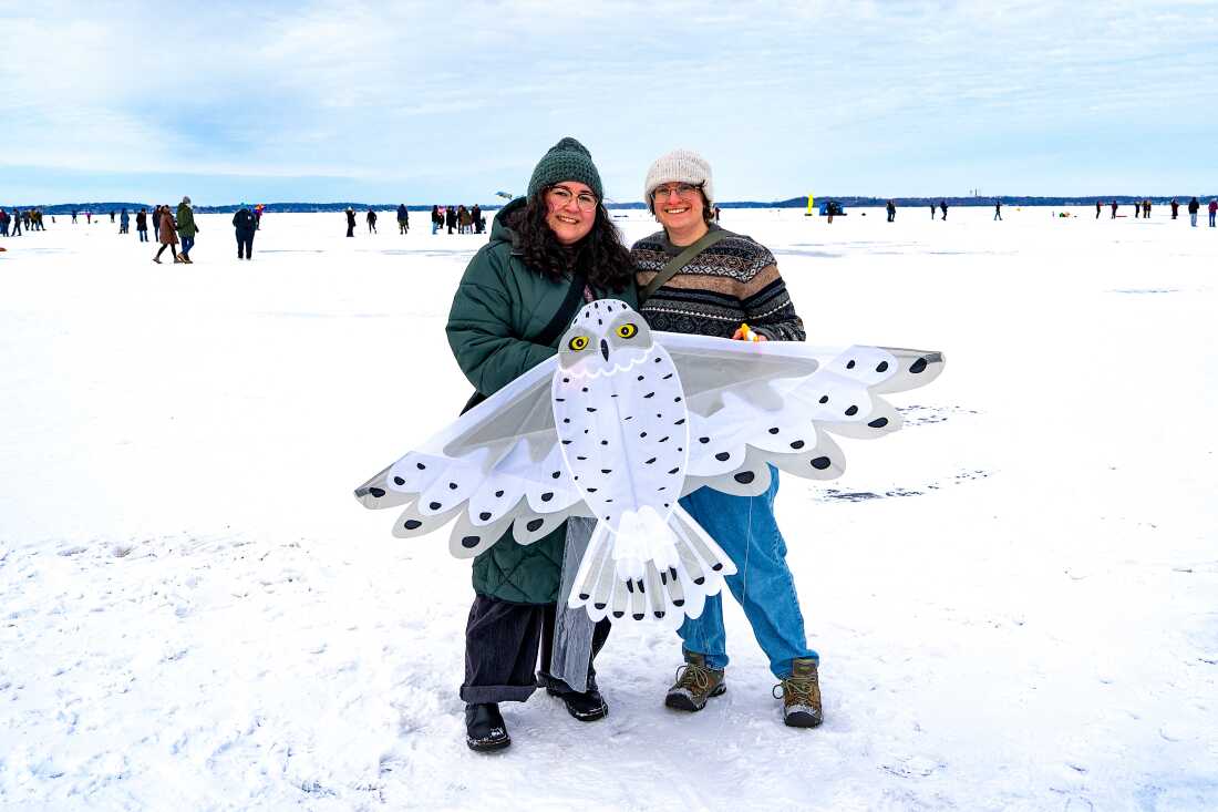 Tannia Serna, left, and Madeline Sudnick pose for a portrait with an owl kite during the Frozen Assets Festival on Lake Mendota on Saturday, Feb. 7, 2026, in Madison, Wisconsin. Photo by Kayla Wolf