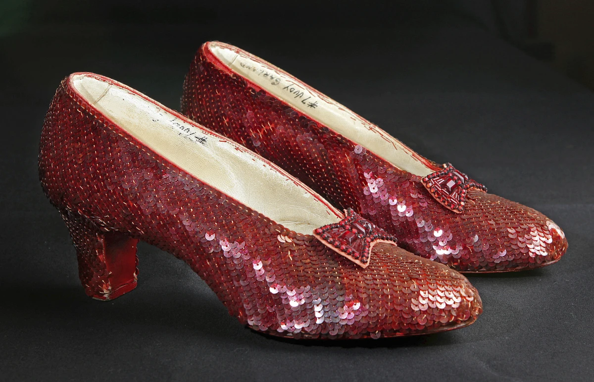 Sequin-covered ruby slippers worn by Judy Garland in The Wizard of Oz appear at the offices of Profiles in History in Calabasas, Calif. on Nov. 9, 2001.