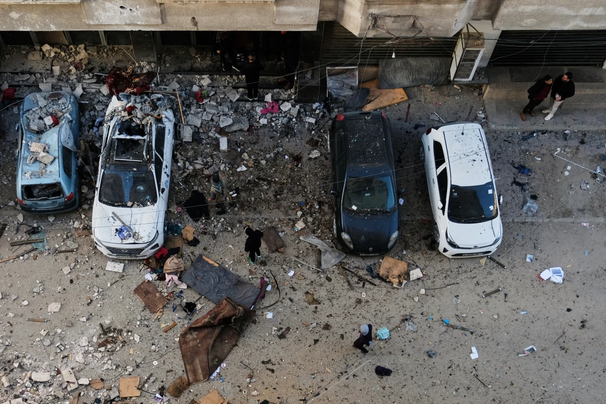 Palestinians survey the damage to an apartment building after an Israeli military strike killed several people in Gaza City Saturday, Jan. 31, 2026.