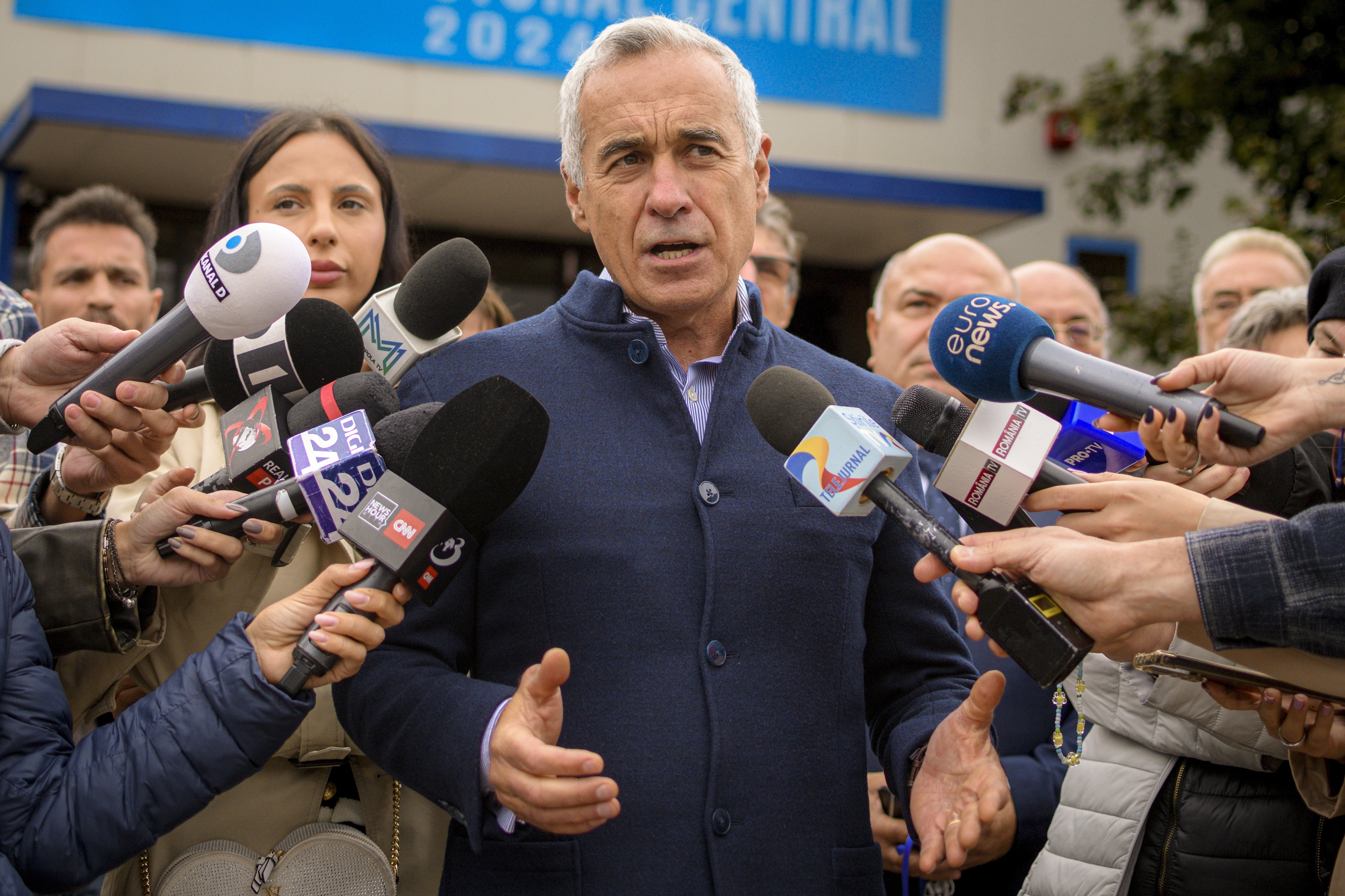 Calin Georgescu, running as an independent candidate for president, speaks to media after registering his bid in the country