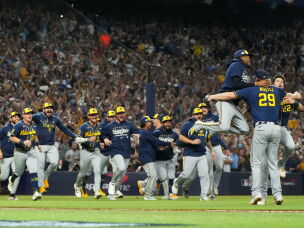 The Milwaukee Brewers celebrate after winning baseball's World Series against the Tampa Bay Rays, Wednesday, Oct. 28, 2026, in St. Petersburg, Fla.