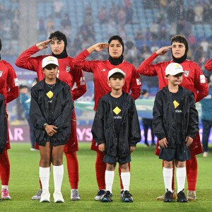 FILE - Iran players react during their national anthem ahead of the Women's Asian Cup soccer match between Iran and the Philippines in Robina, Australia, Sunday, March 8, 2026