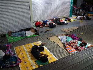Families who have loved ones being treated at the All India Institute of Medical Sciences in New Delhi try to get some rest. Thousands of patients and their families travel from across India, sometimes thousands of kilometers, to seek treatment at the hospital. Many who can't afford accommodations sleep on pavement, in subways and in other public spaces near the hospital while waiting for appointments or treatment.