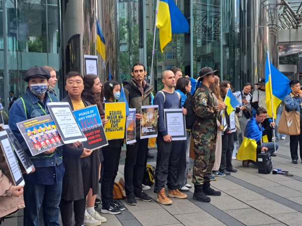 Members of the Ukrainian community in Taiwan, alongside Taiwanese supporters, gather outside Moscow’s representative office in Taipei to protest the three-year anniversary of Russia’s full-scale invasion of Ukraine.
