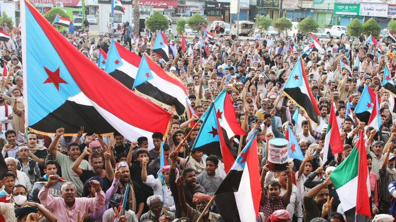 Supporters of the Southern Transitional Council (STC), a coalition of separatist groups seeking to restore the state of South Yemen, hold South Yemen flags during a rally, in Aden, Yemen, Friday.