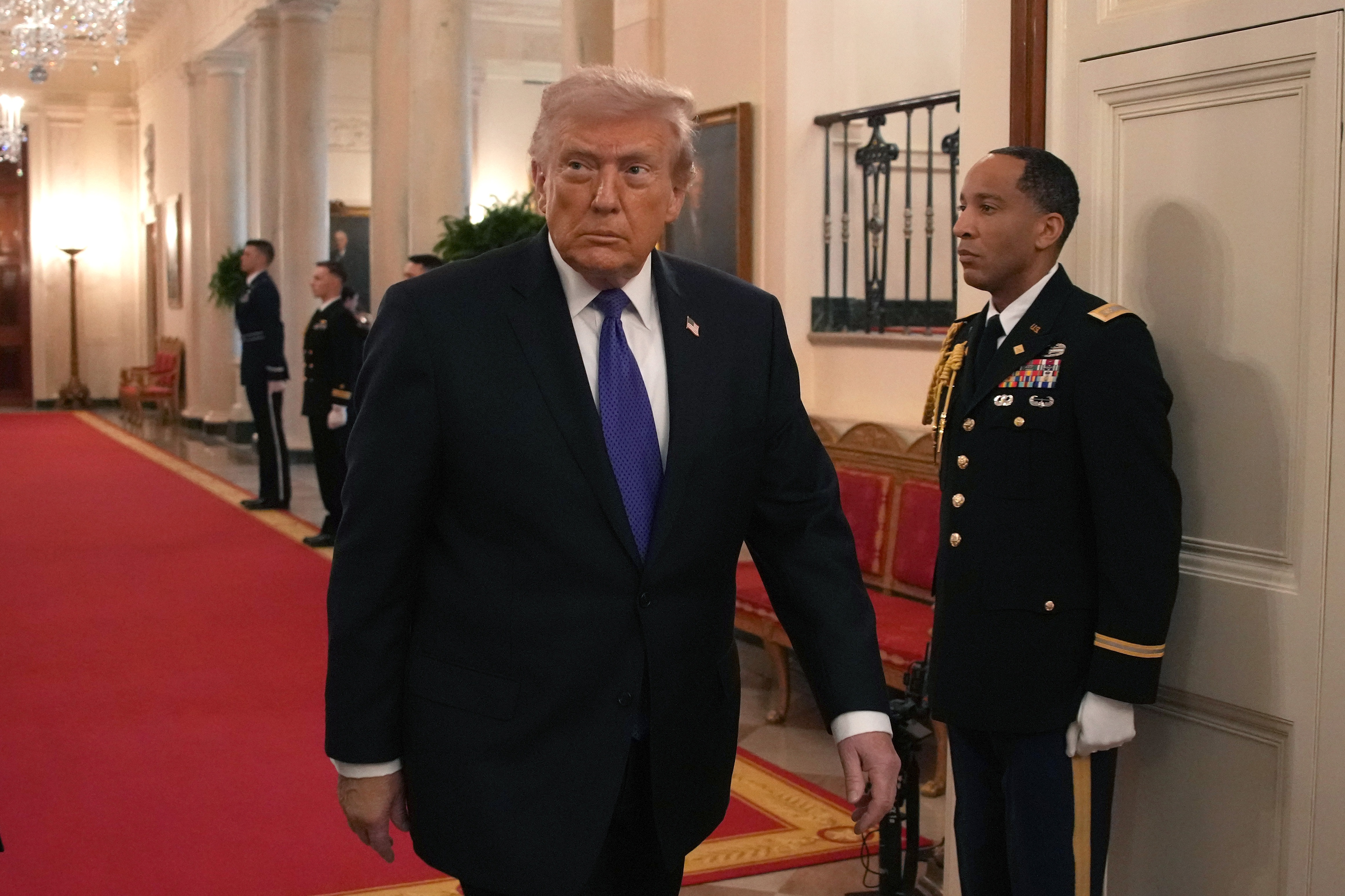 President Trump defended the U.S. military operation in Iran in public remarks Monday, before awarding the Medal of Honor to three soldiers.