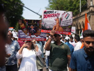 Protesters hold placards during a protest organized by Shiv Sena (UBT) and the Maharashtra Navnirman Sena, demanding the resignation of Chief Election Commissioner Gyanesh Kumar and the suspension of the Special Intensive Revision (SIR) of electoral rolls, in Mumbai, India, Sunday, Oct. 4, 2026.