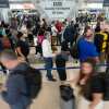 Travelers wait in long security checkpoint lines at George Bush Intercontinental Airport Friday, March 27, 2026, in Houston.