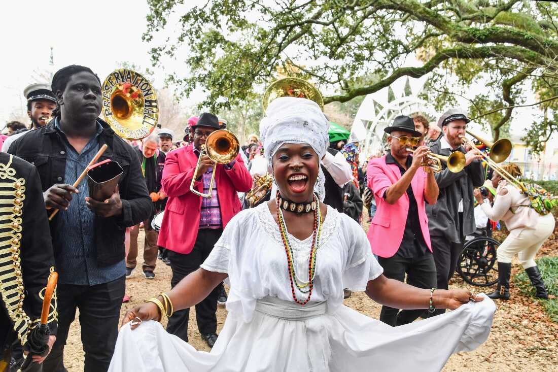 The group Krewe du Kanaval celebrates Mardi Gras season in New Orleans' Congo Square in Feb. 2018.