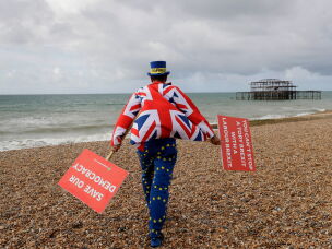 Anti Brexit campaigner Steve Bray walks on the beach to pose for a photograph during the Labour Party Conference at the Brighton Centre in Brighton, England, Monday, Sept. 23, 2019.
