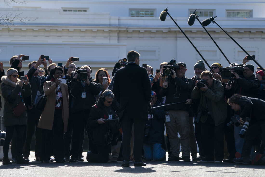 Then-CNN White House correspondent Jim Acosta talks with reporters as he returns to the White House after his press pass was restored on Nov. 16, 2018, in Washington.