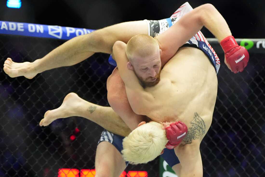 Bo Nickal, top, fights against Kyle Daukaus during their middleweight bout at UFC Freedom 250 on the South Lawn of the White House, Sunday, June 14, 2026, in Washington.