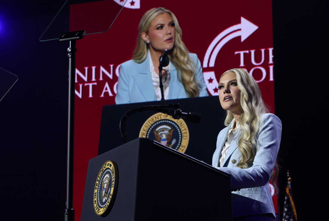 Standing behind a lectern equipped with a microphone, Turning Point USA CEO Erika Kirk speaks during a Turning Point event at Dream City Church in Phoenix on April 17.