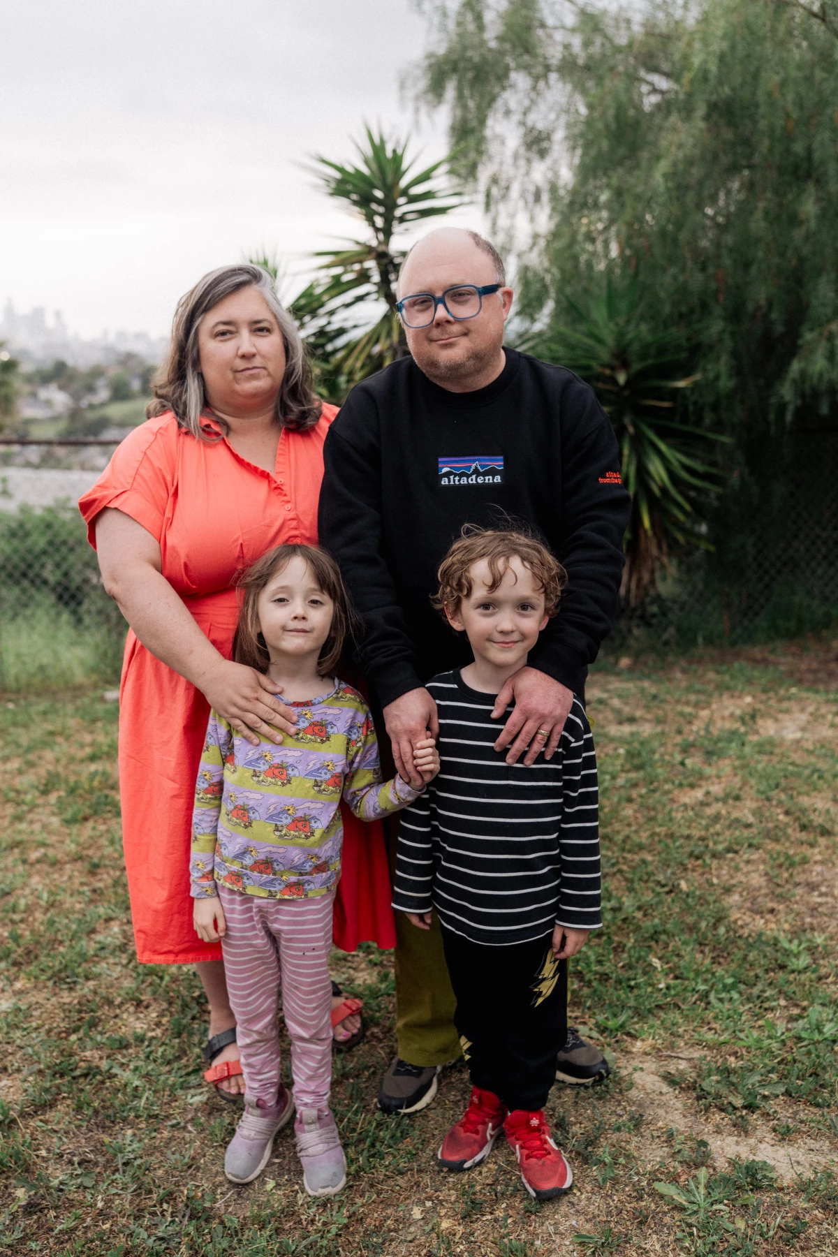 The Eakin family poses for a portrait down the street from their temporary home in El Sereno, Calif.