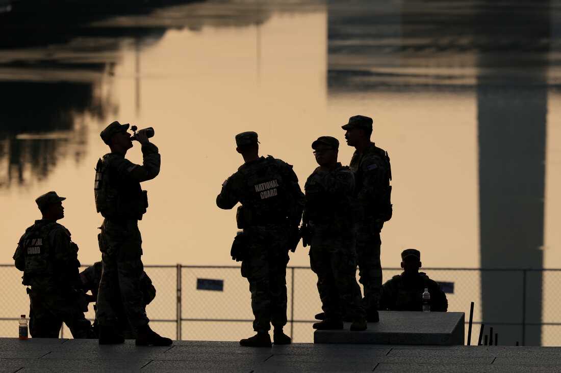 Members of the Army National Guard congregate near the Lincoln Memorial Reflecting Pool on July 02, 2026 in Washington, DC.