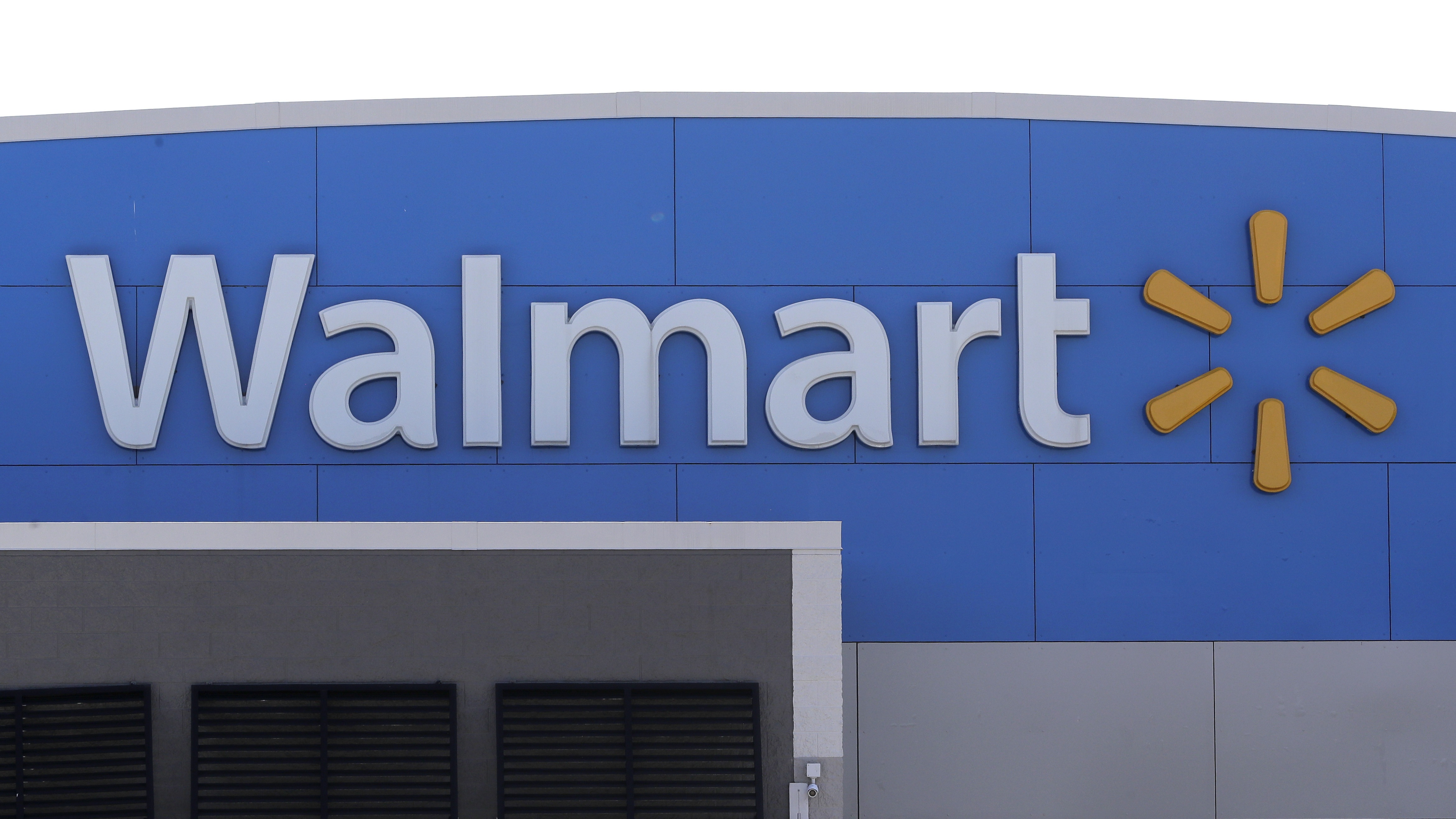 A Walmart logo is displayed outside of a Walmart store in Walpole, Mass. (AP)