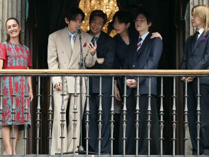 (L-R) Mexico President Claudia Sheinbaum stands with BTS members V, RM, Jung Kook, Suga and Jimin as they greet fans from the balcony of the National Palace at Zócalo Square in Mexico City, May 6, 2026. BTS held three sold-out shows at Estadio GNP Seguros.