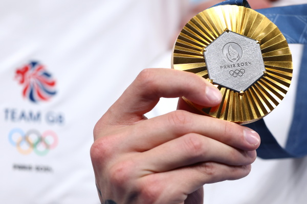 Gold medals are the big prize in Paris. China and the U.S. are running neck and neck when it comes to gold. But on a per capita basis tiny Australia is punching above its weight.