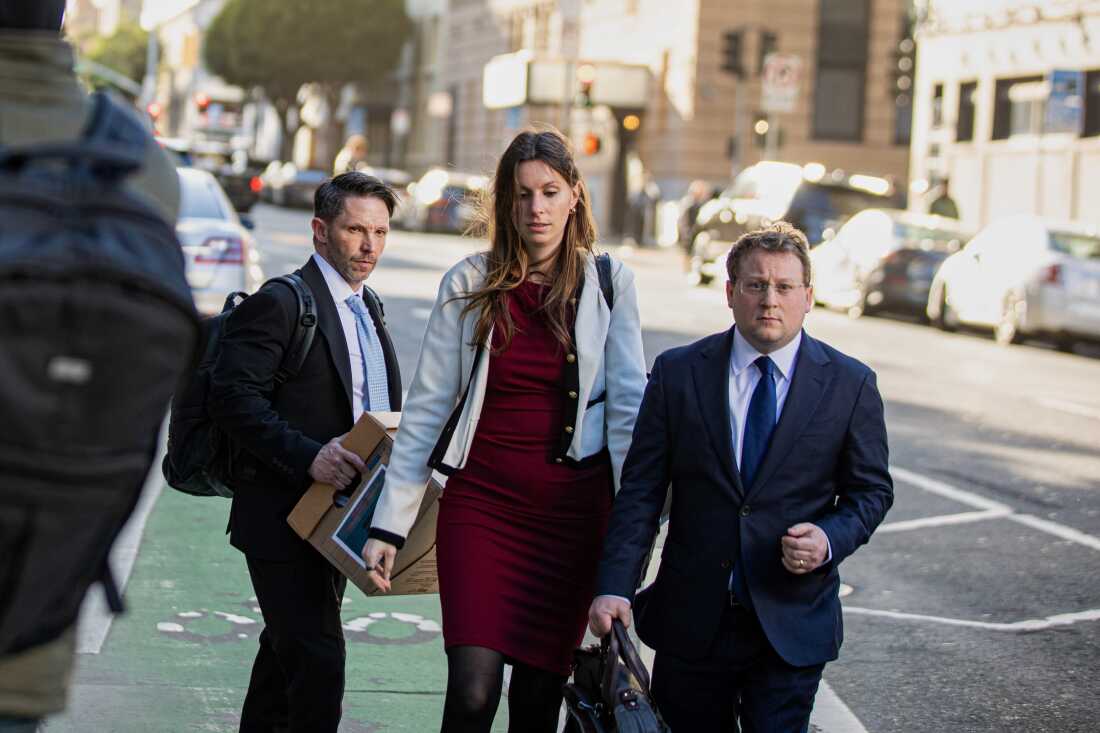 Members of Elon Musk's legal team, including attorney Michael Lifrak (left), exit the Phillip Burton Federal Building in San Francisco on March 4.