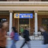 Students walk past a polling site at the University of Pittsburgh during the 2022 midterm election in Pittsburgh, Pa.