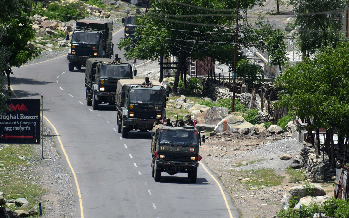 An Indian army convoy moves along the Srinagar-Leh National Highway toward Ladakh on June 17, 2020. At least 20 Indian soldiers were killed in a violent clash with Chinese forces in a disputed border area.