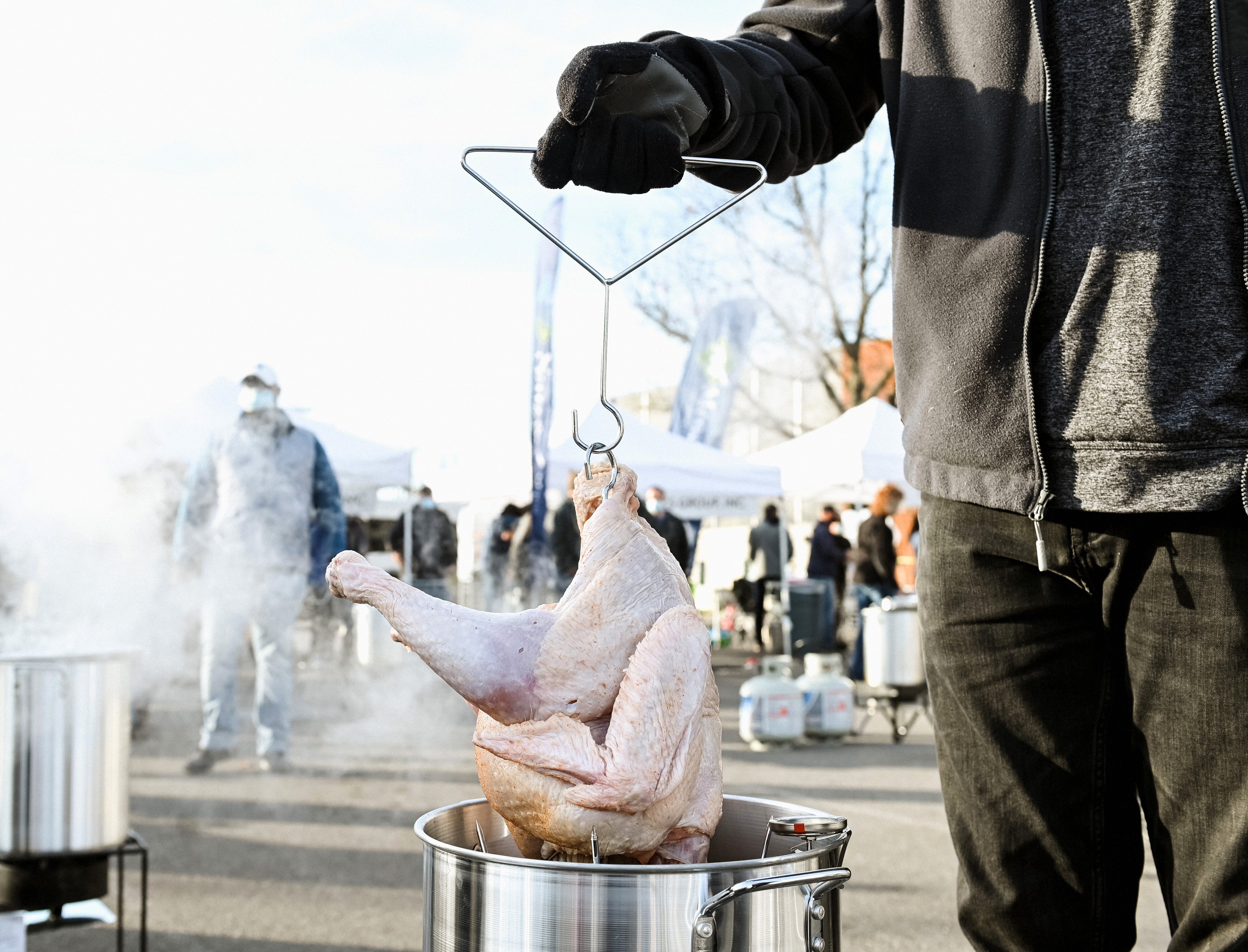 Participants are seen deep frying turkey on November 24, 2020, in Nashville, Tennessee.
