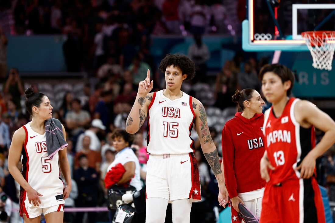 Team USA's Brittney Griner (15) played her first international basketball game since her detention in Russia. She helped the USA women power by Japan in the opening game of group play on Monday as the U.S. aims for an unprecedented eighth straight gold medal.