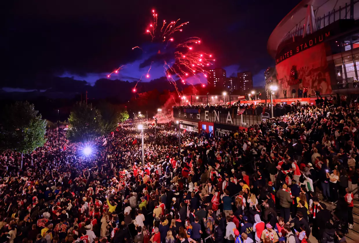 Arsenal fans celebrate winning the Premier League at Emirates Stadium on May 19, 2026 in London, England.