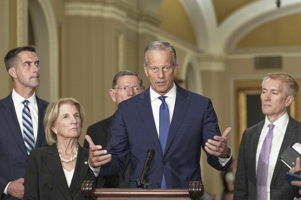Sen. Majority Leader John Thune, R-S.D., center, speaks during a news conference after a policy luncheon at the Capitol Tuesday, July 29, 2025, in Washington.