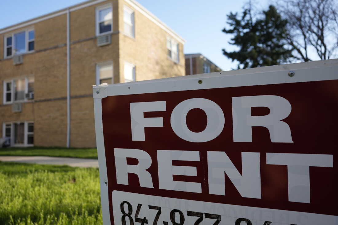 A "For Rent" sign displays outside an apartment building in Skokie, Ill., in 2024. Researchers from the Urban Institute found that a growing number of renters in the U.S. are struggling to pay for housing each month.
