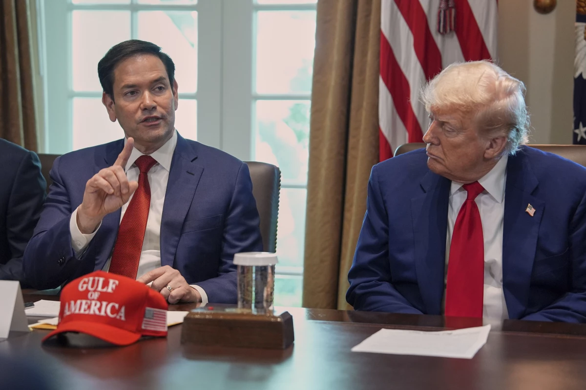 Secretary of State Marco Rubio speaks during a cabinet meeting at the White House, Wednesday, April 30, in Washington, as President Donald Trump look on.