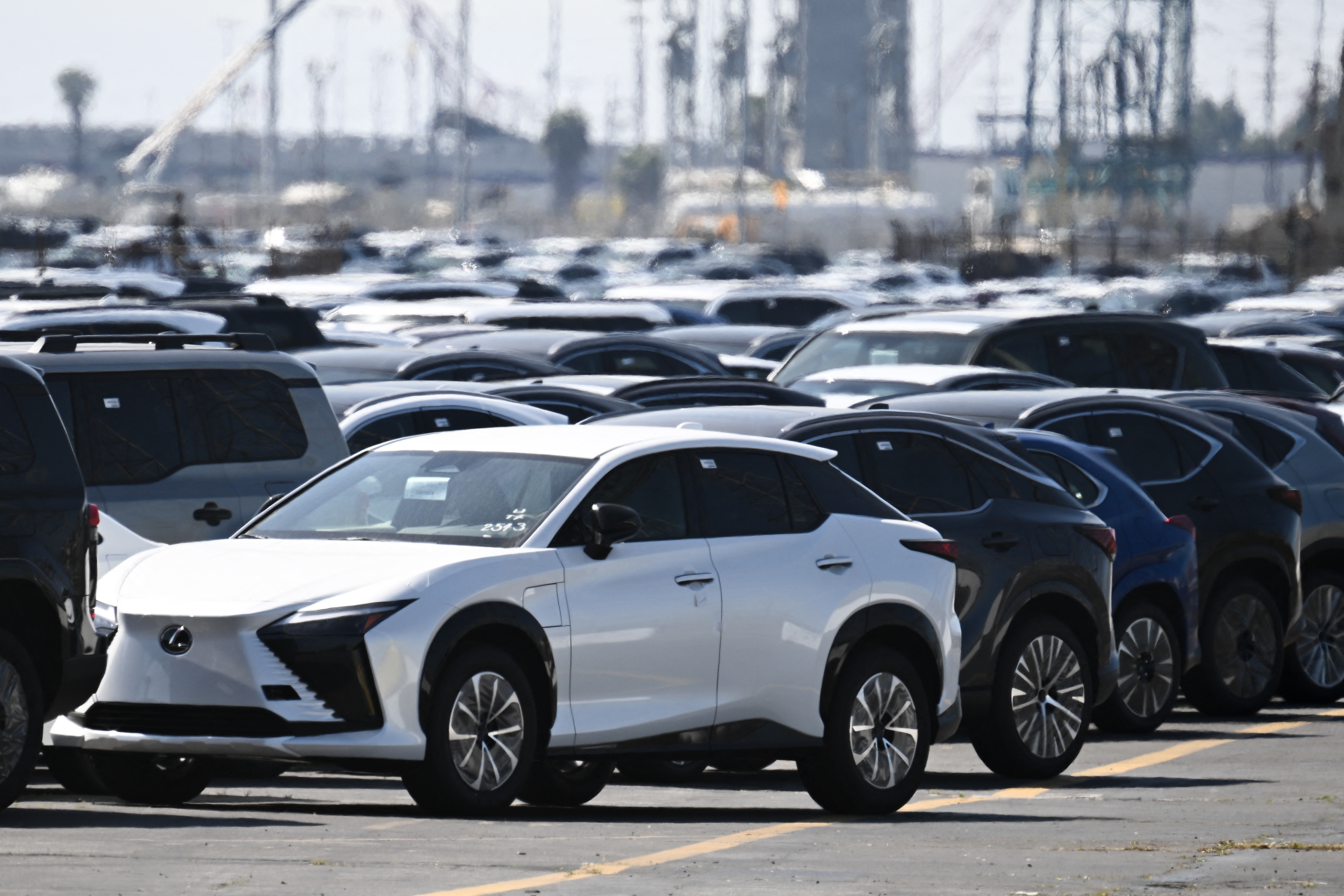 Toyota and Lexus cars unloaded from ships sit parked at the Toyota Logistics Services Inc. automotive processing terminal at the Port of Long Beach in Long Beach, Calif. on April 10, 2025.