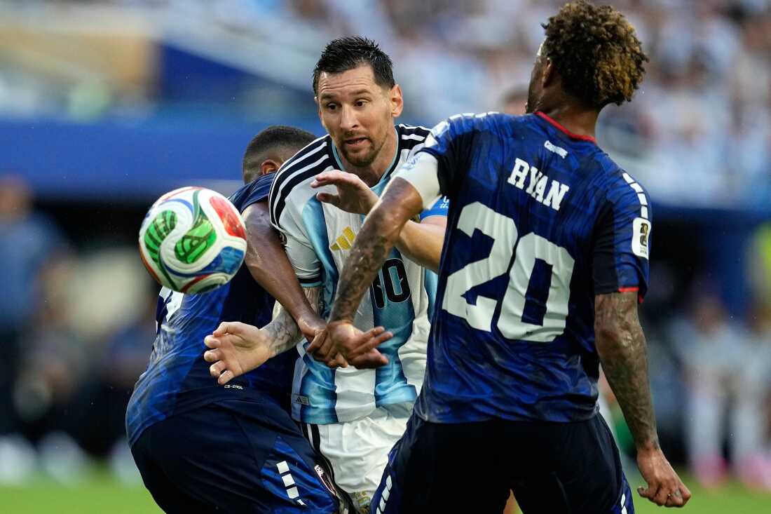 Argentina's Lionel Messi (10) battles with Cape Verde's Deroy Duarte (14) and Ryan Mendes (20) during the World Cup round of 32 soccer match between Argentina and Cape Verde in Miami Gardens, Fla., Friday, July 3, 2026.