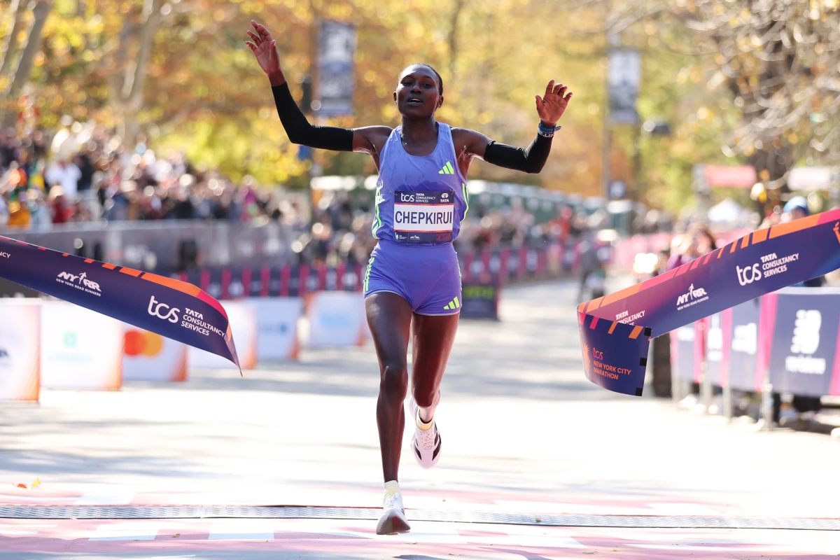 Sheila Chepkirui of Kenya crosses the finish line to win the women's division of the New York City Marathon on Sunday in New York City.