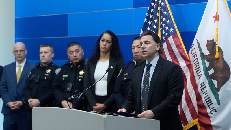 Matt Cobo, F.B.I. San Francisco Acting Special Agent in Charge ( right) speaks next to San Francisco Police Chief Derrick Lew (second from right) and San Francisco District Attorney Brooke Jenkins (third from right) during a news conference Monday, April 13, 2026, in San Francisco. )
