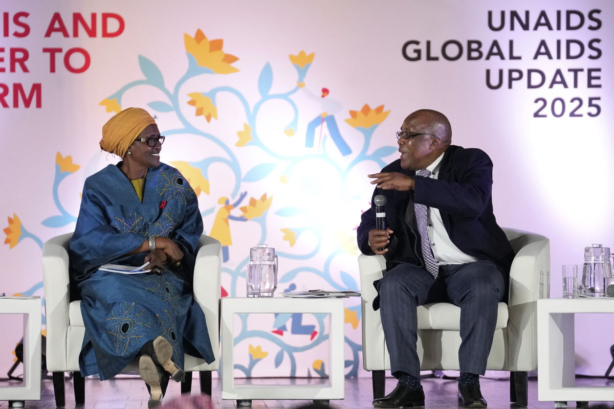 South Africa's Minister of Health Aaron Motsoaledi, right, speaks as Winnie Byanyima, executive director of UNAIDS, watches during the release of the UNAIDS report at Bertha Gxowa Hospital in Germiston, South Africa,