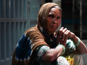 Suhana Bano, 47, from Bareilly, Uttar Pradesh, has been bringing her 18-year-old son, Mohammad Sameer, to Delhi for medical treatment for about two years. Bano has been staying on the pavement for the past month while waiting for her son's next appointment at the hospital.