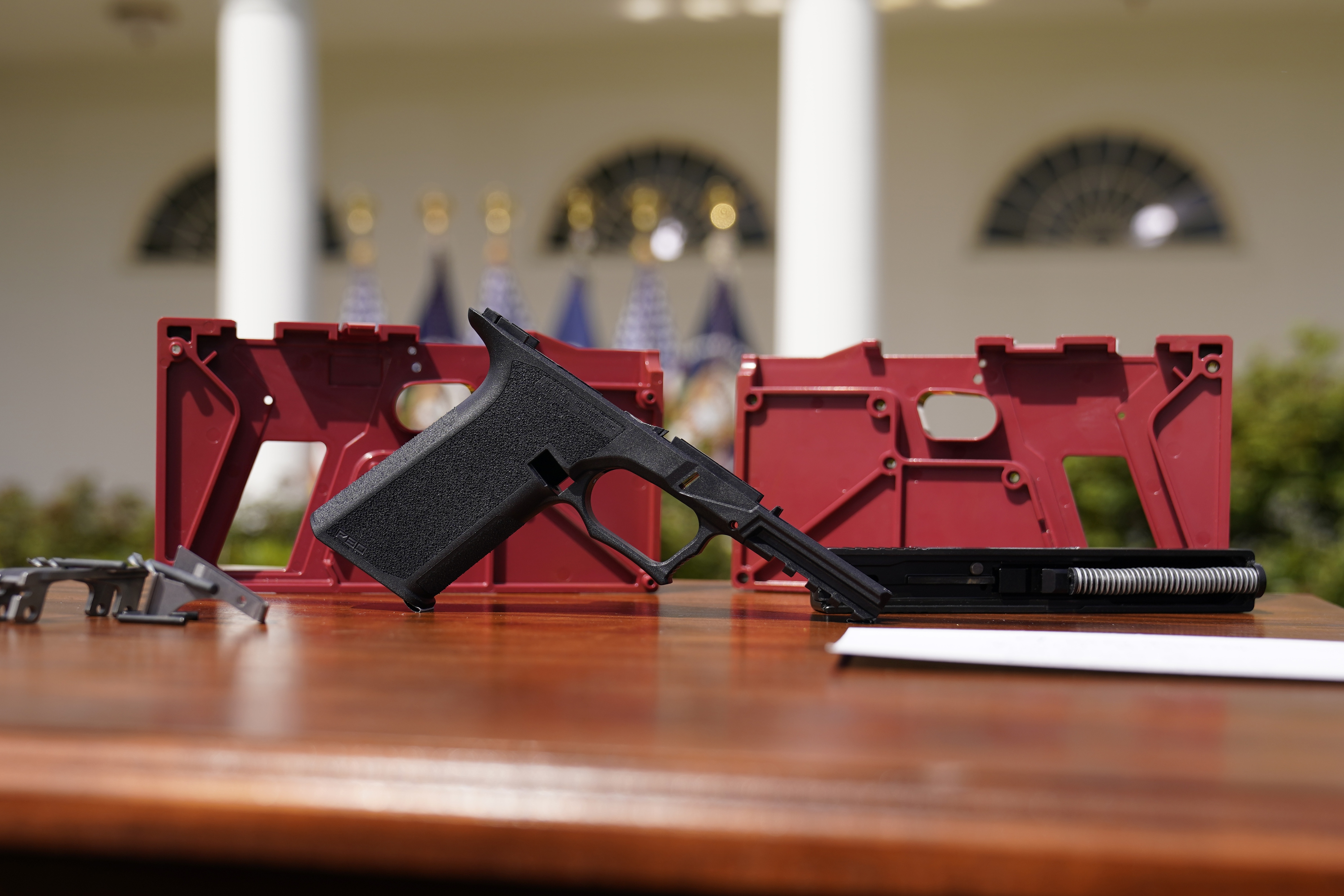 A 9mm pistol build kit with a commercial slide and barrel with a polymer frame is displayed before President Joe Biden and Deputy Attorney General Lisa Monaco speak in the Rose Garden of the White House in Washington, Monday, April 11, 2022, to announce a final version of its ghost gun rule, which comes as the White House and the Justice Department are under growing pressure to crack down on gun deaths. (AP)