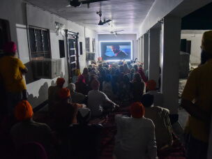 Villagers watch a special screening of the film <em>Satluj</em> at a Sikh temple at Tatley village, in Punjab's Gurdaspur district, India, on July 8.