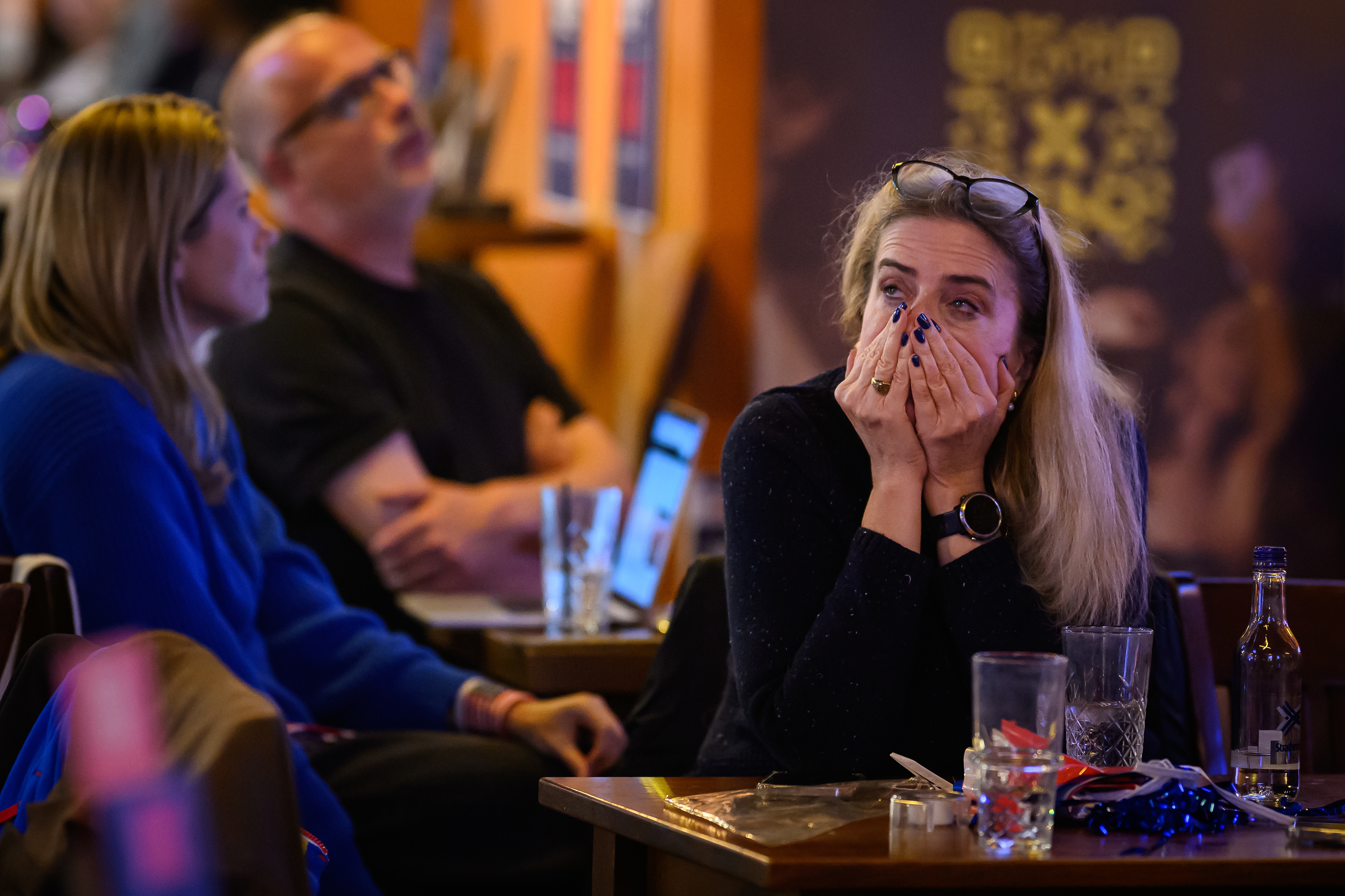 Supporters of U.S. Vice President Kamala Harris react as results are displayed during a Democrats Abroad election party on Wednesday in London, England.