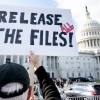A protester holds a sign related to the release of the Jeffrey Epstein case files outside the U.S. Capitol on November 12, 2025.