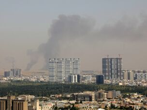Smoke rises after explosions were heard and air defenses activated near the airport in Irbil, in the Kurdistan region of northern Iraq, on Friday. Several blasts sounded near the Irbil airport, which hosts U.S.-led coalition troops, an AFP journalist said.