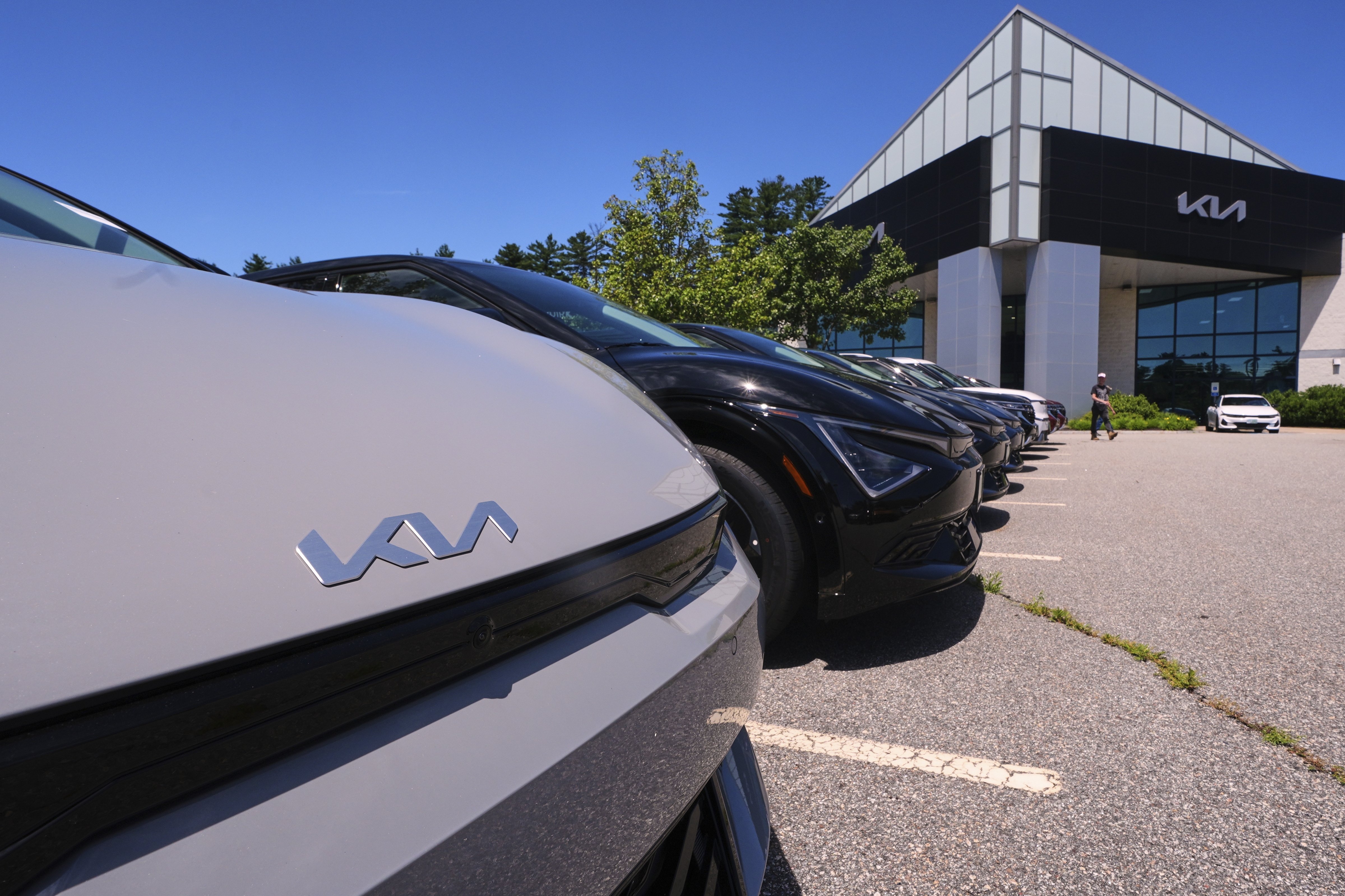 A selection of Kia EV6 electric sedans are displayed at a dealership in Manchester, N.H., in July. The EV6 is eligible for a federal tax credit worth up to $7,500 for buyers under a certain income cap. And like all electric vehicles, it's eligible for a $7,500 tax credit on a lease. But the tax credits are expiring on Sept. 30th. (AP)