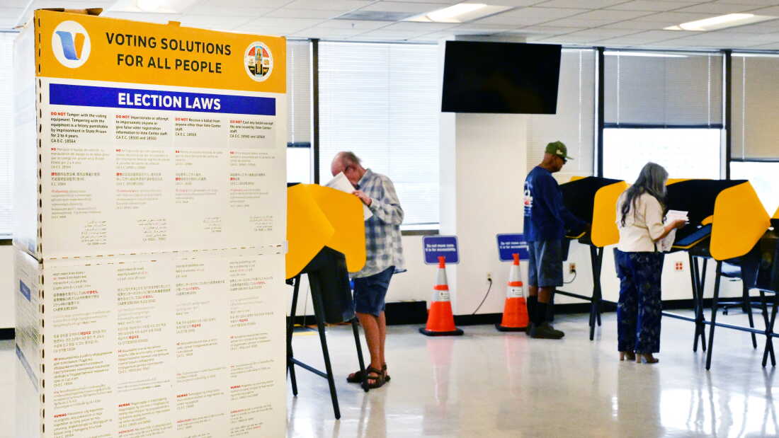 People vote in Norwalk, Calif., during early voting in California's primary election on June 1, 2026. The Department of Justice has charged 28 green card holders in the state for allegedly illegally registering to vote or voting in U.S. elections, in an escalation of a feud with California officials over the state’s voting system.